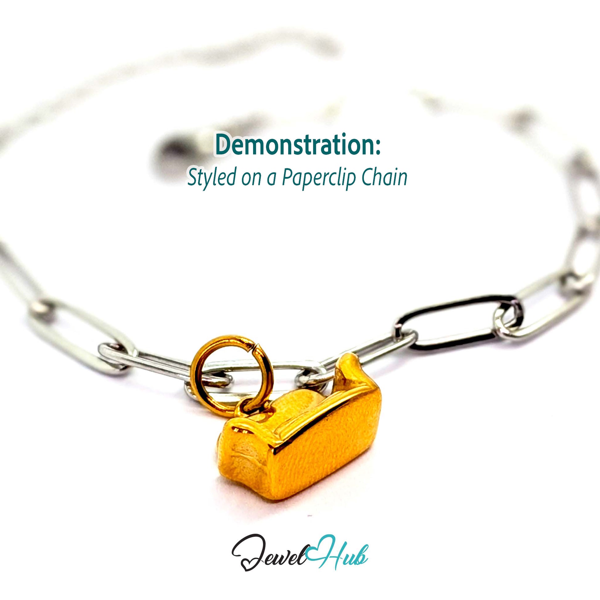 Three-dimensional sofa charm in gold stainless steel - styled on a silver paperclip chain bracelet - JewelHub