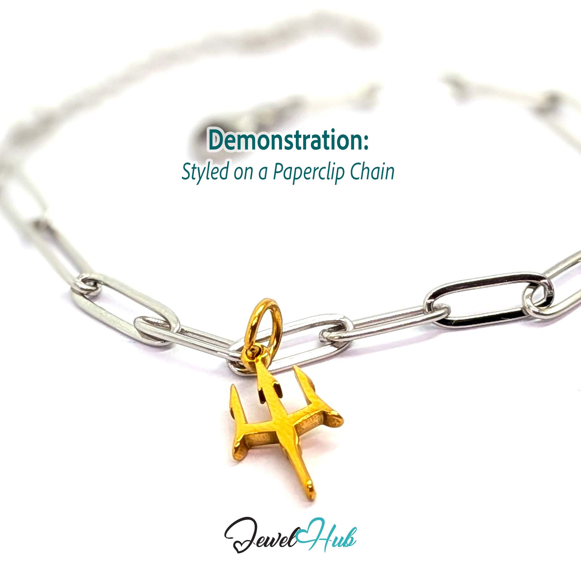 Trident charm in gold stainless steel - styled on a silver paperclip chain bracelet - JewelHub