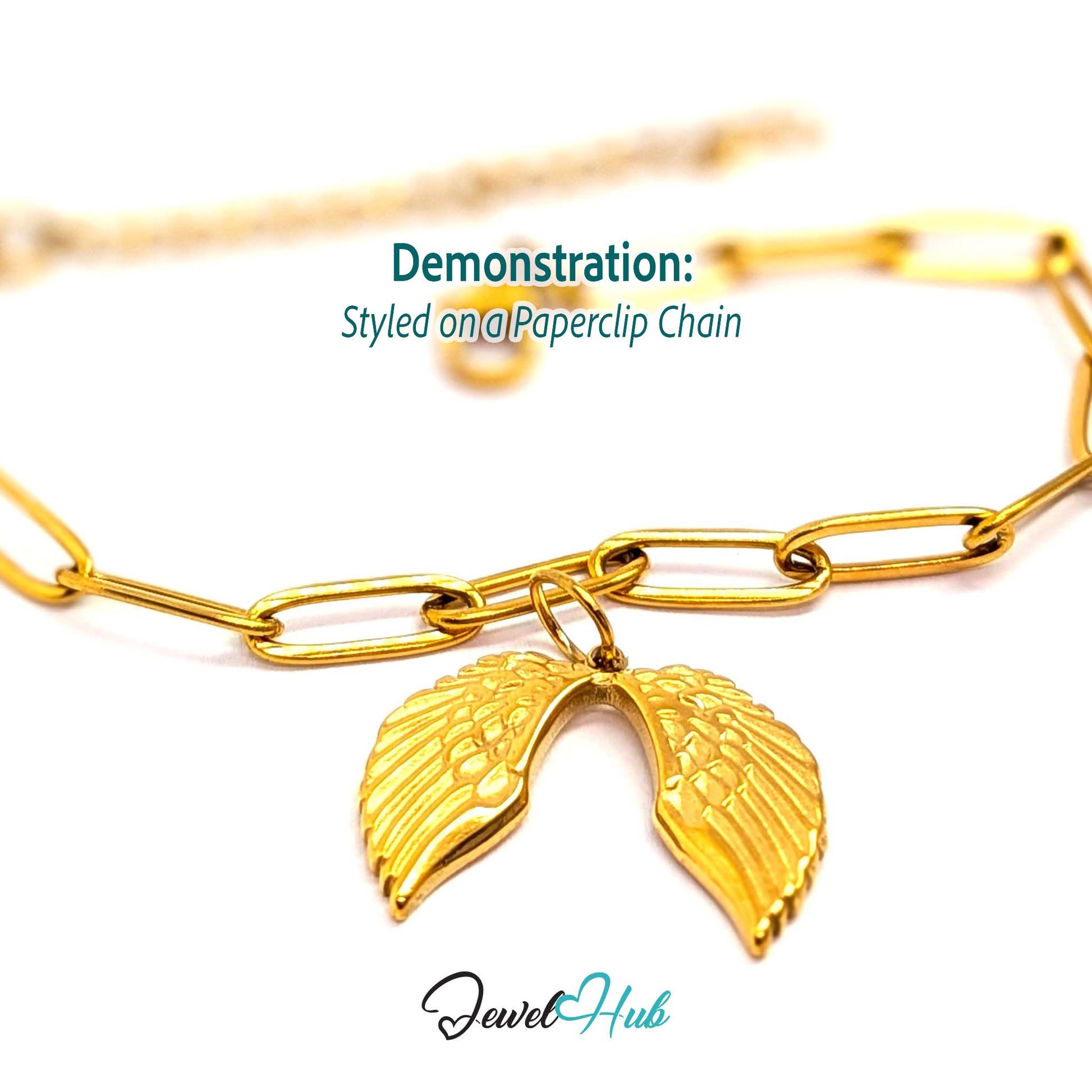 Angel wings charm in gold stainless steel - styled on a gold paperclip chain bracelet - JewelHub
