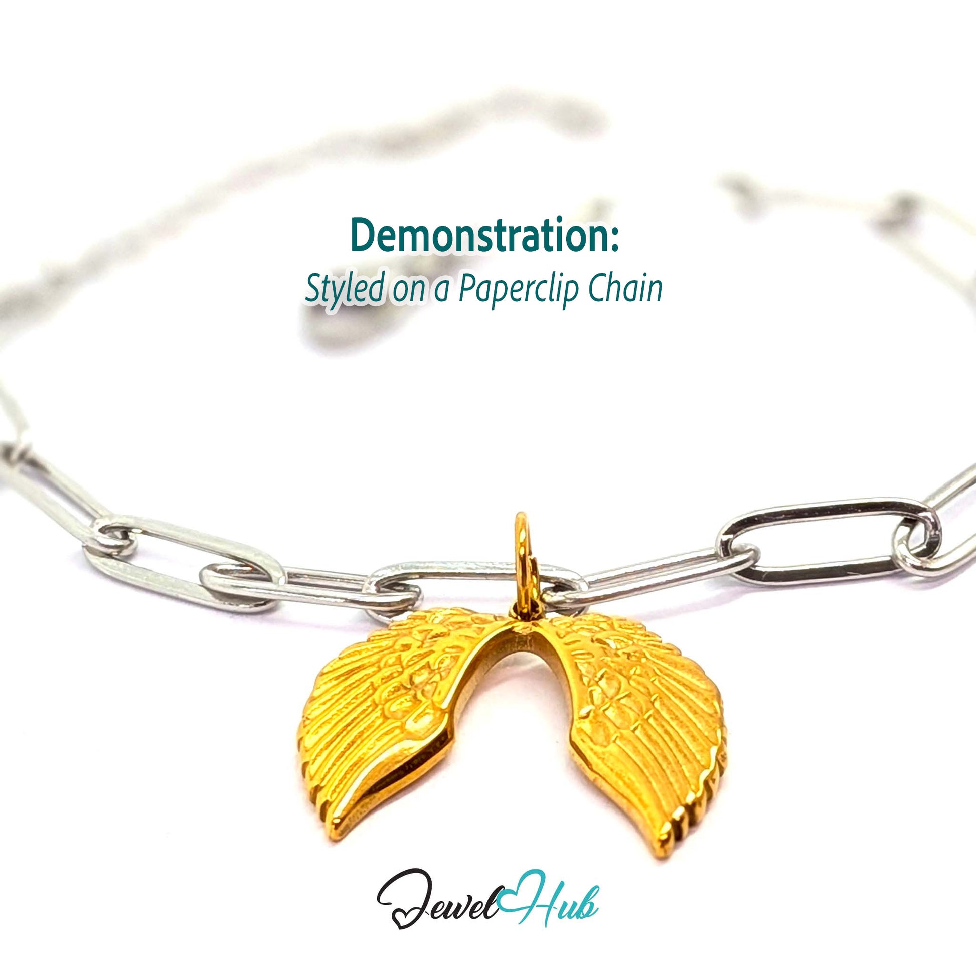 Angel wings charm in gold stainless steel - styled on a silver paperclip chain bracelet - JewelHub