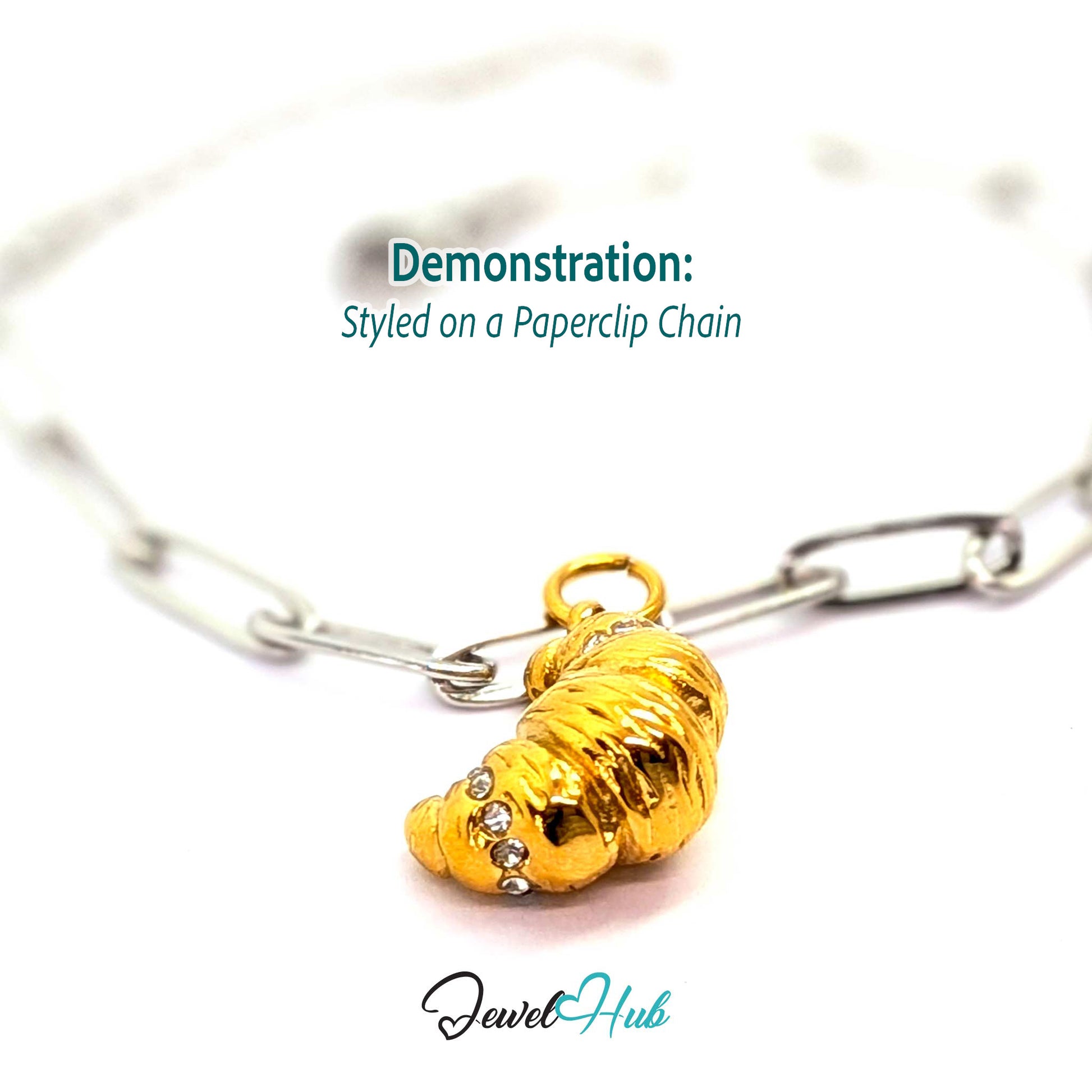 Croissant charm in gold stainless steel with clear crystals - styled on a silver paperclip chain bracelet - JewelHub