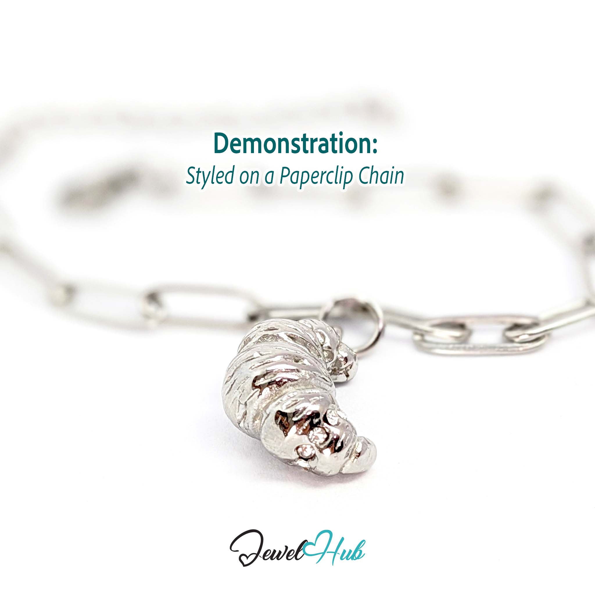 Croissant charm in silver stainless steel with clear crystals - styled on a silver paperclip chain bracelet - JewelHub