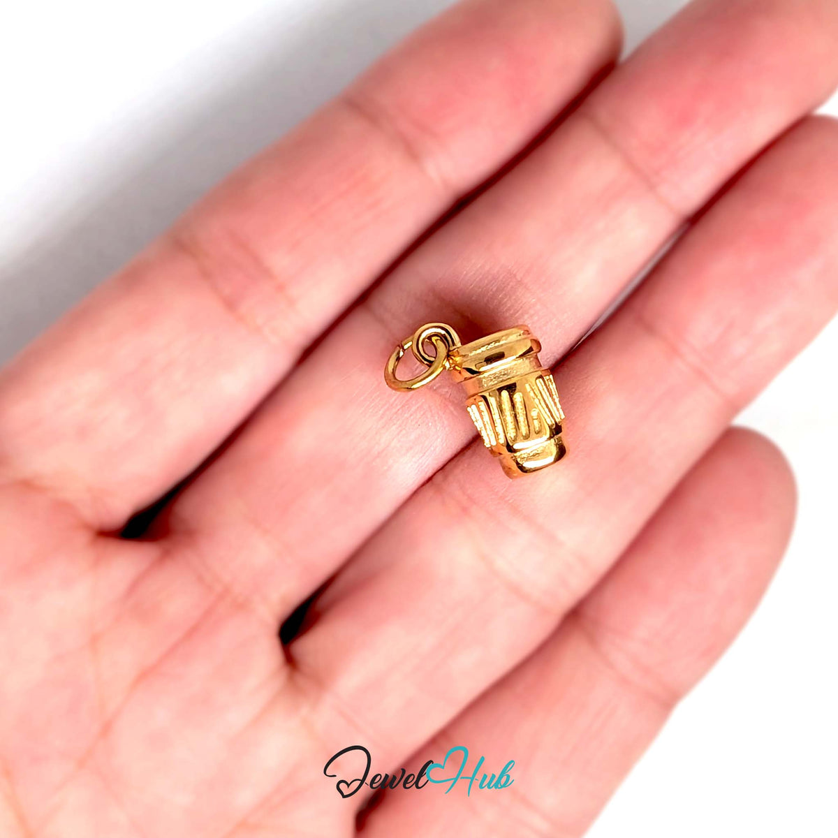 Takeaway coffee cup charm held in a hand to show its size - JewelHub