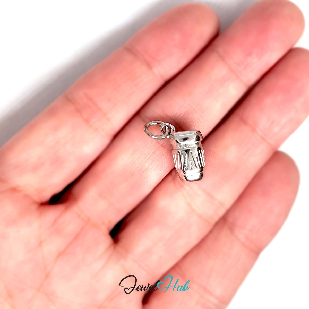 Takeaway coffee cup charm held in a hand to show its size - JewelHub
