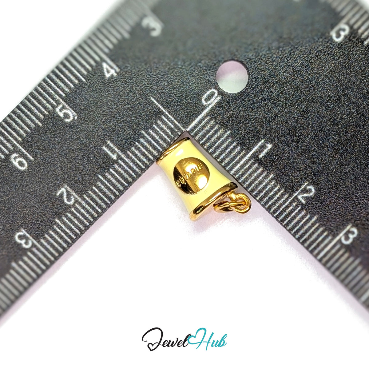 Yellow enamel matcha cup charm measured against a ruler at 9.5mm wide by 16mm tall - JewelHub
