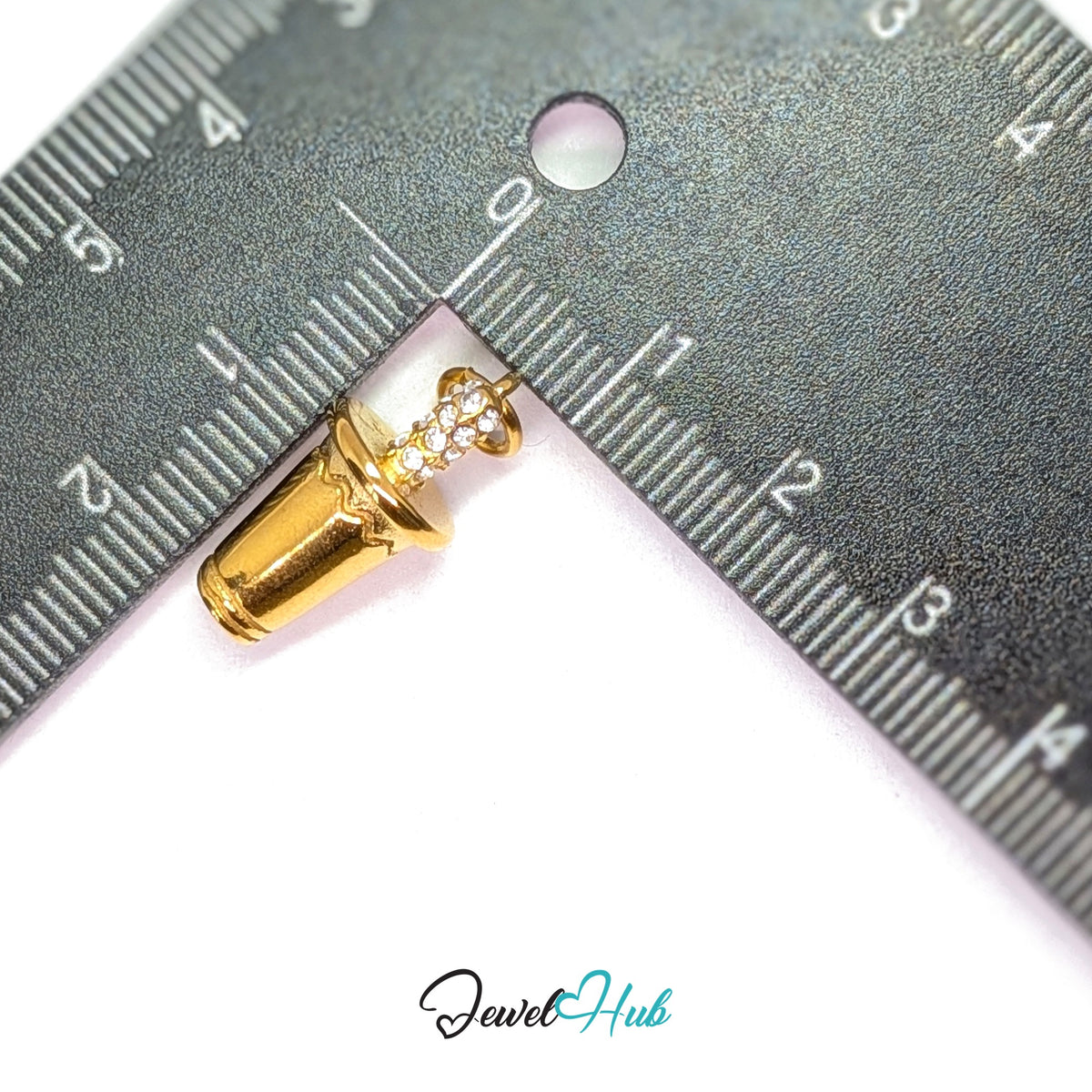 Crystal straw tumbler charm measured against a ruler at 10.3mm wide by 21mm tall - JewelHub