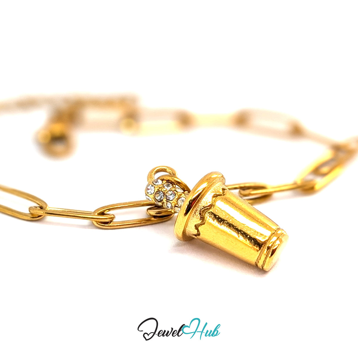 Gold-tone crystal straw tumbler charm styled on a gold paperclip chain bracelet - JewelHub