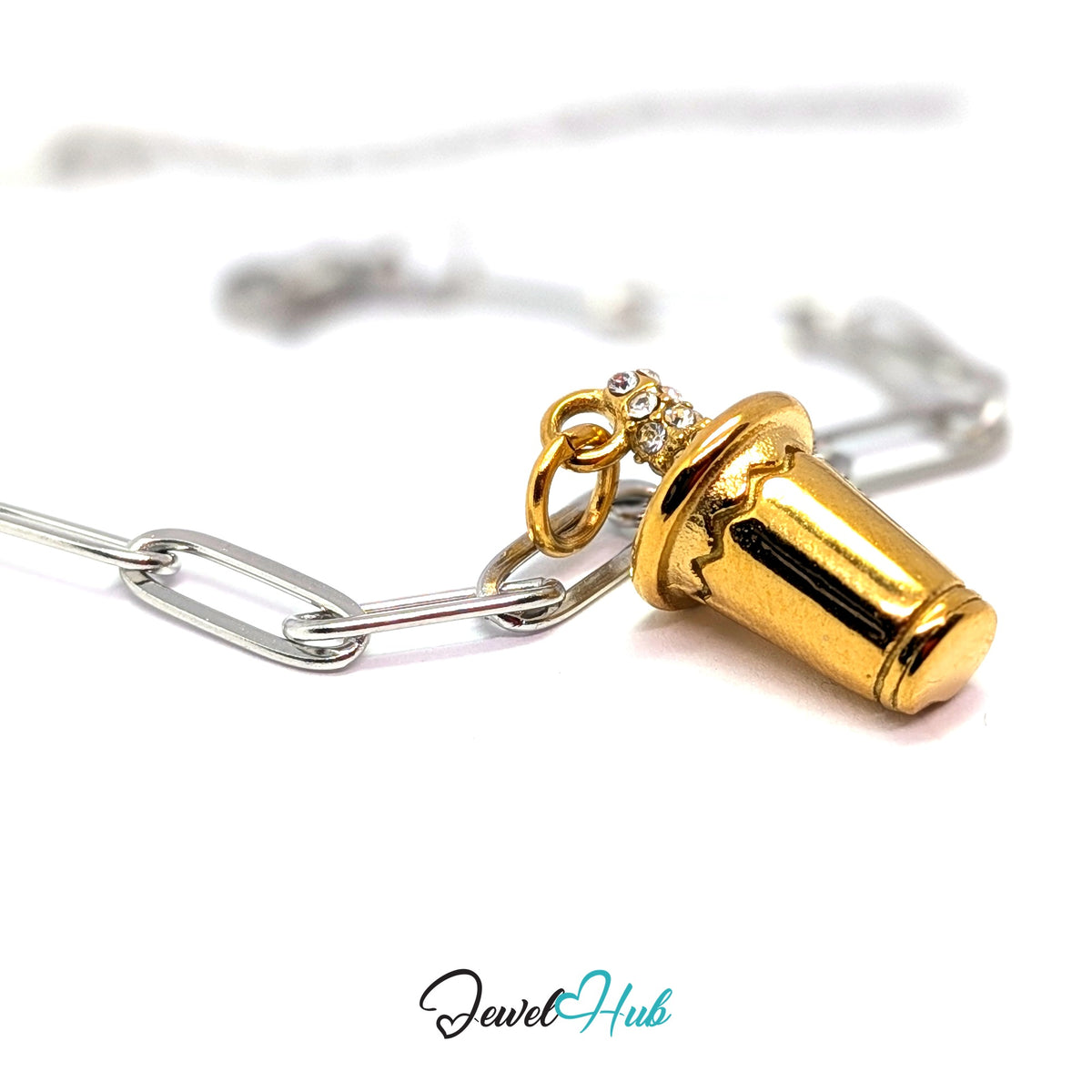 Gold-tone crystal straw tumbler charm styled on a silver paperclip chain bracelet for a two-tone look - JewelHub