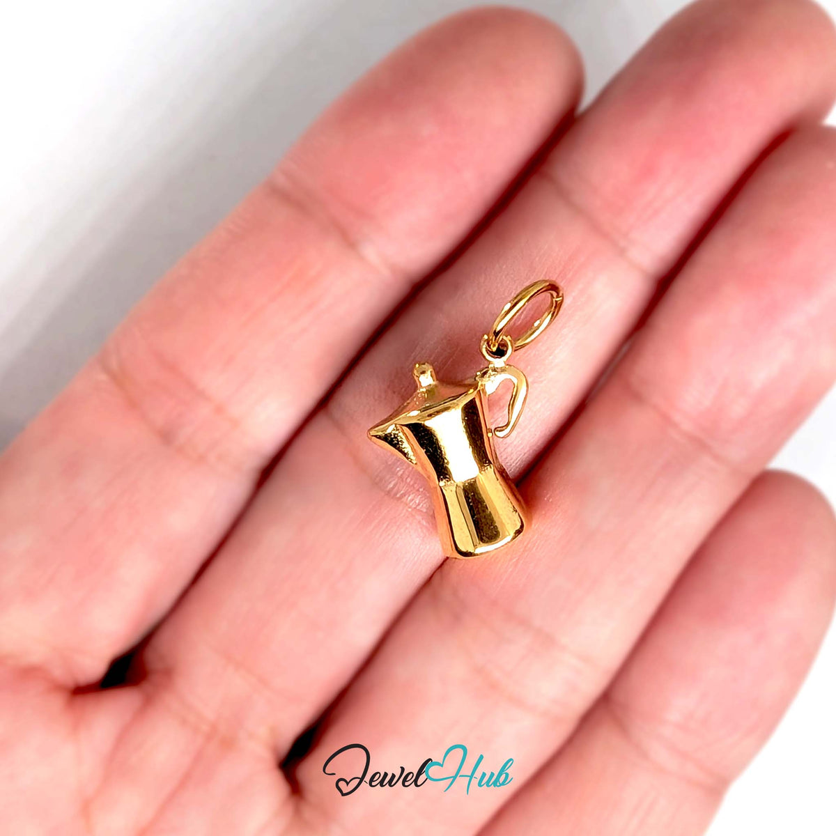 Moka pot charm held in a hand to show its size - JewelHub