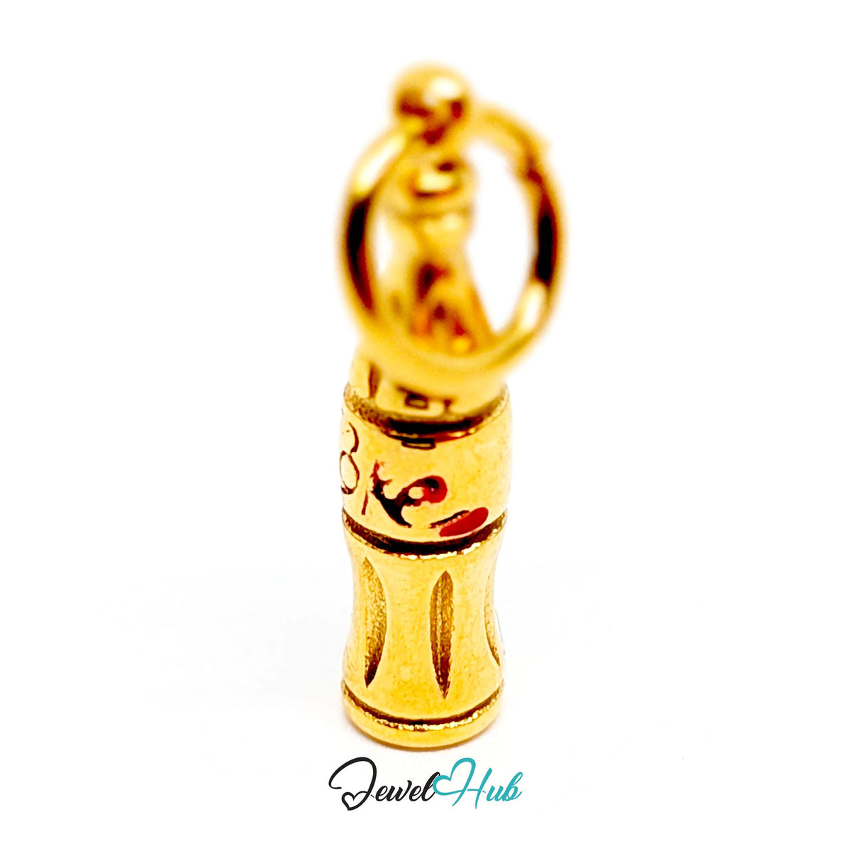 Close-up of the gold-tone soda bottle charm detail - JewelHub