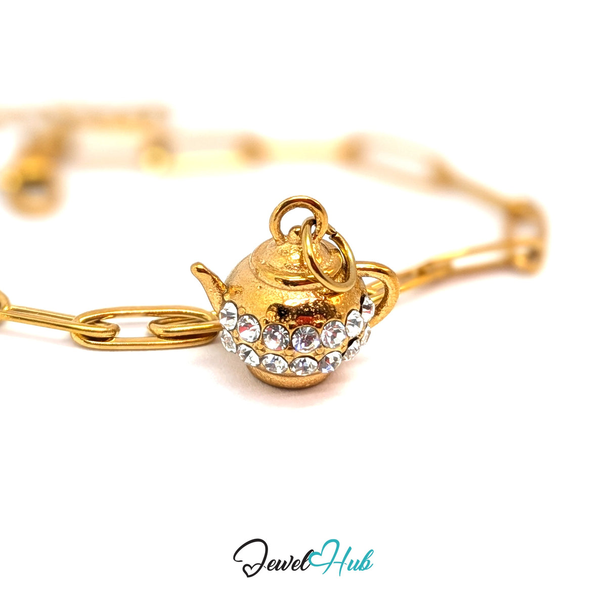 Gold-tone crystal teapot charm styled on a gold paperclip chain bracelet - JewelHub