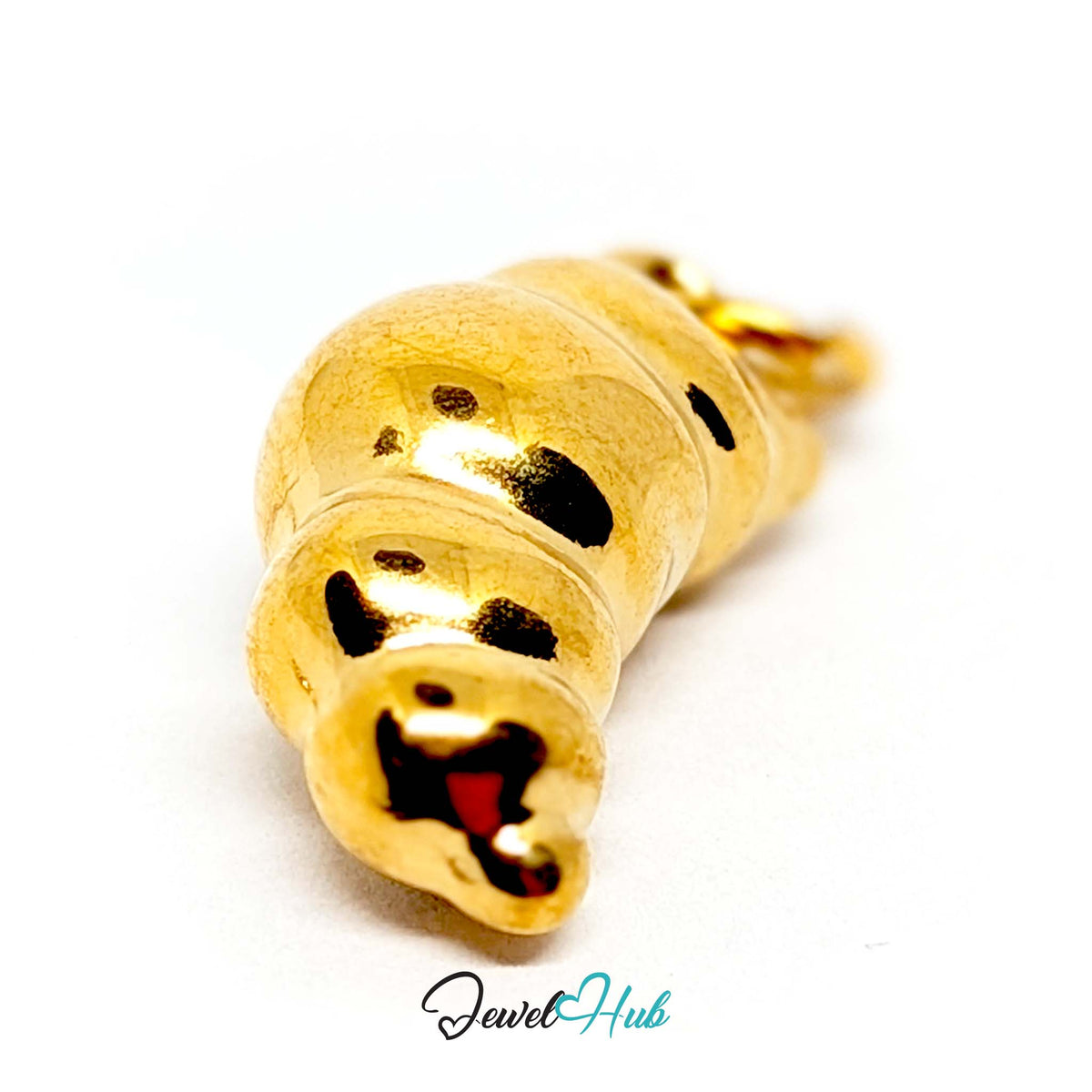Close-up of the gold-tone chunky croissant charm detail - JewelHub