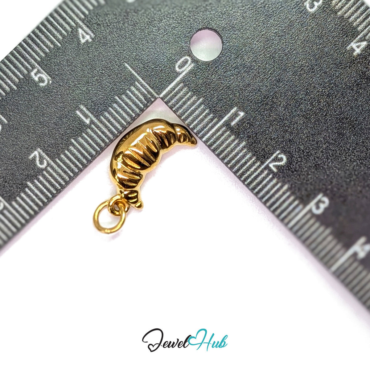Chunky croissant charm measured against a ruler at 9.4mm wide by 18.6mm tall - JewelHub
