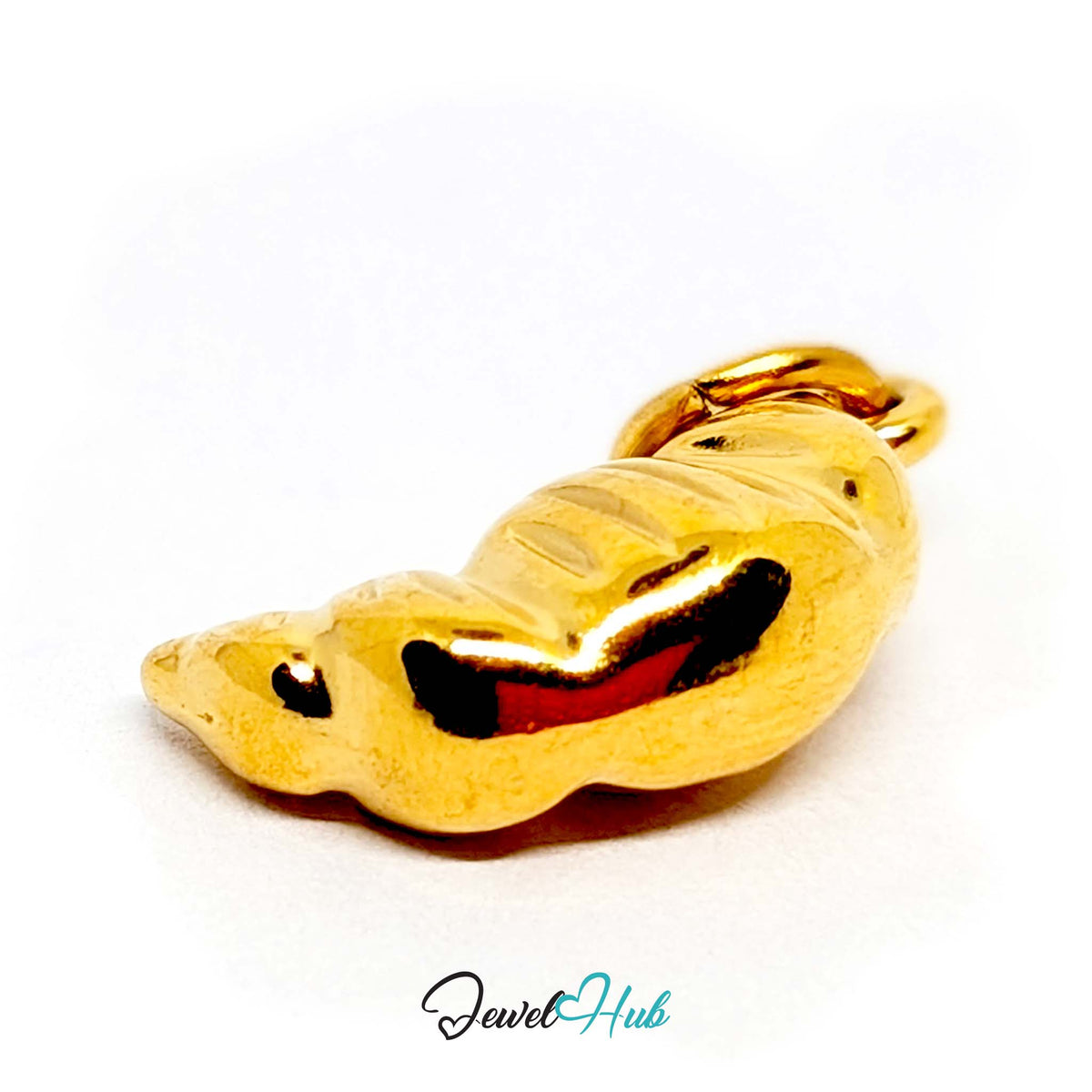 Close-up of the gold-tone slim ridged croissant charm detail - JewelHub