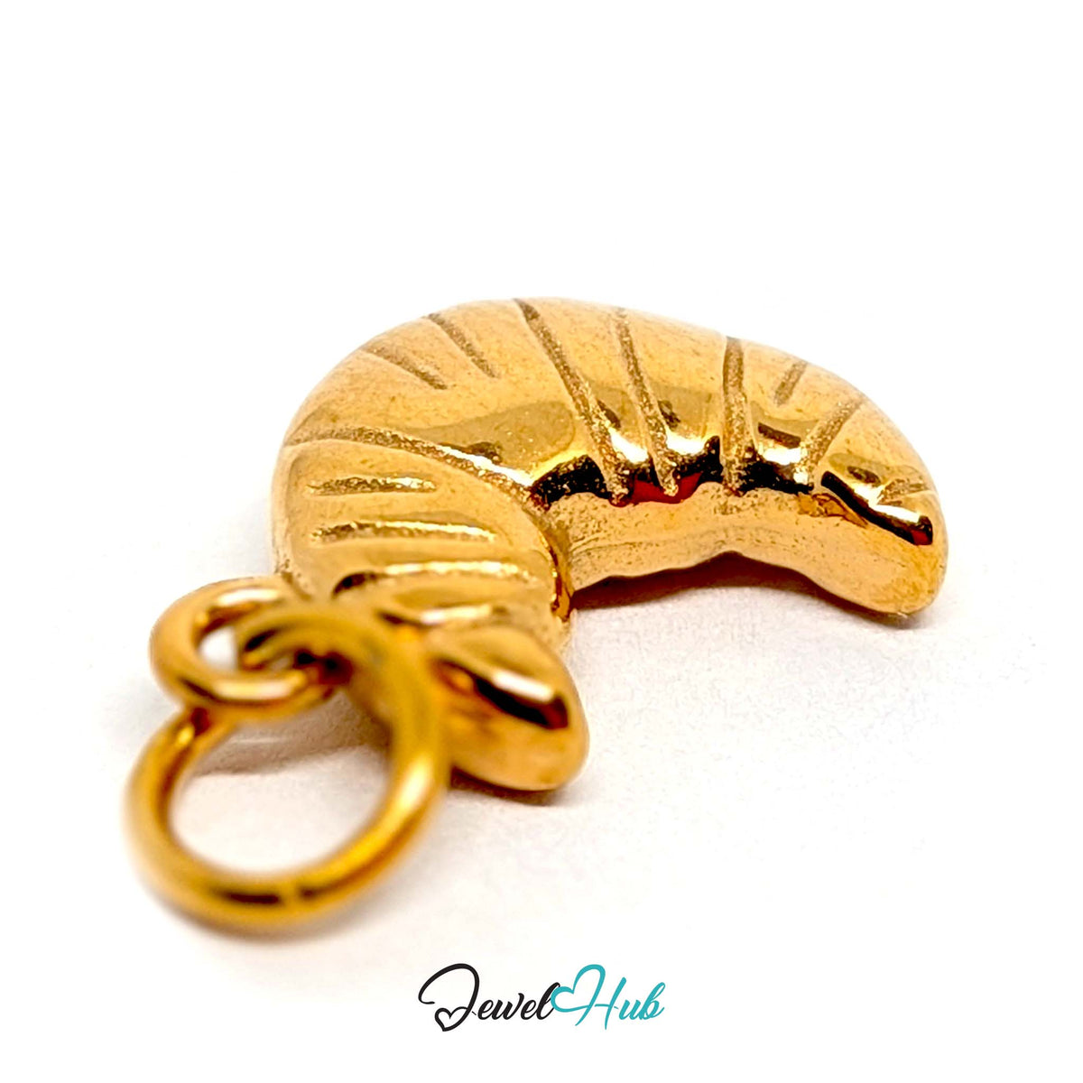 Angled view of the gold-tone curved croissant charm - JewelHub