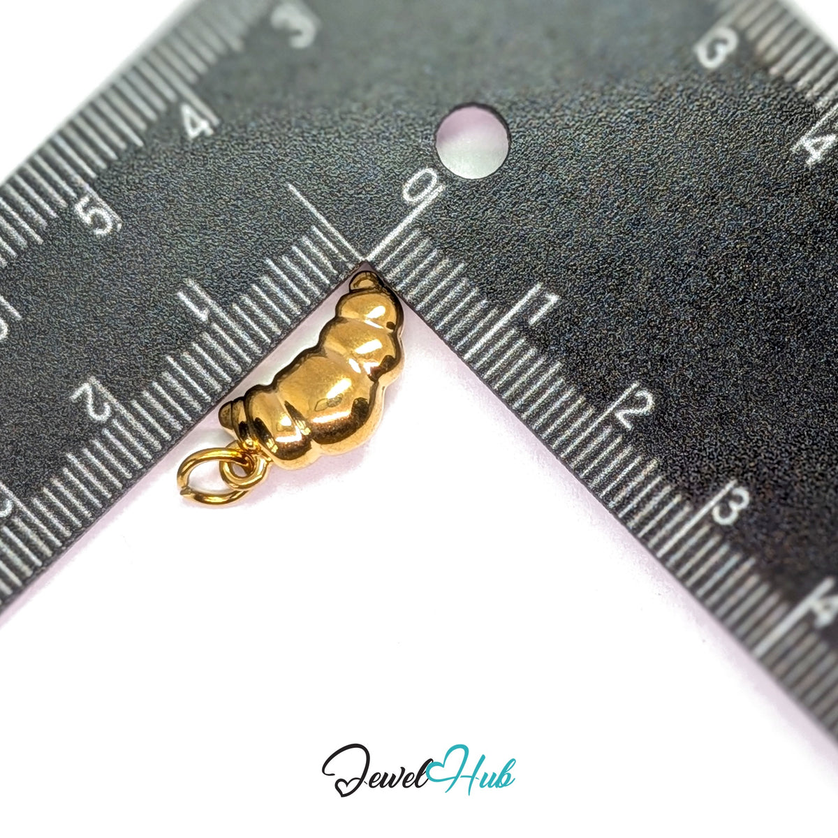 Curved croissant charm measured against a ruler at 10.7mm wide by 14.2mm tall - JewelHub