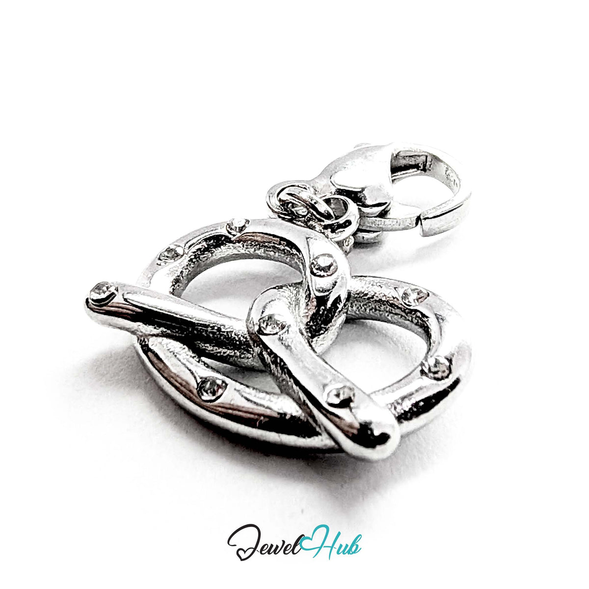 Close-up of the silver-tone pretzel charm detail - JewelHub