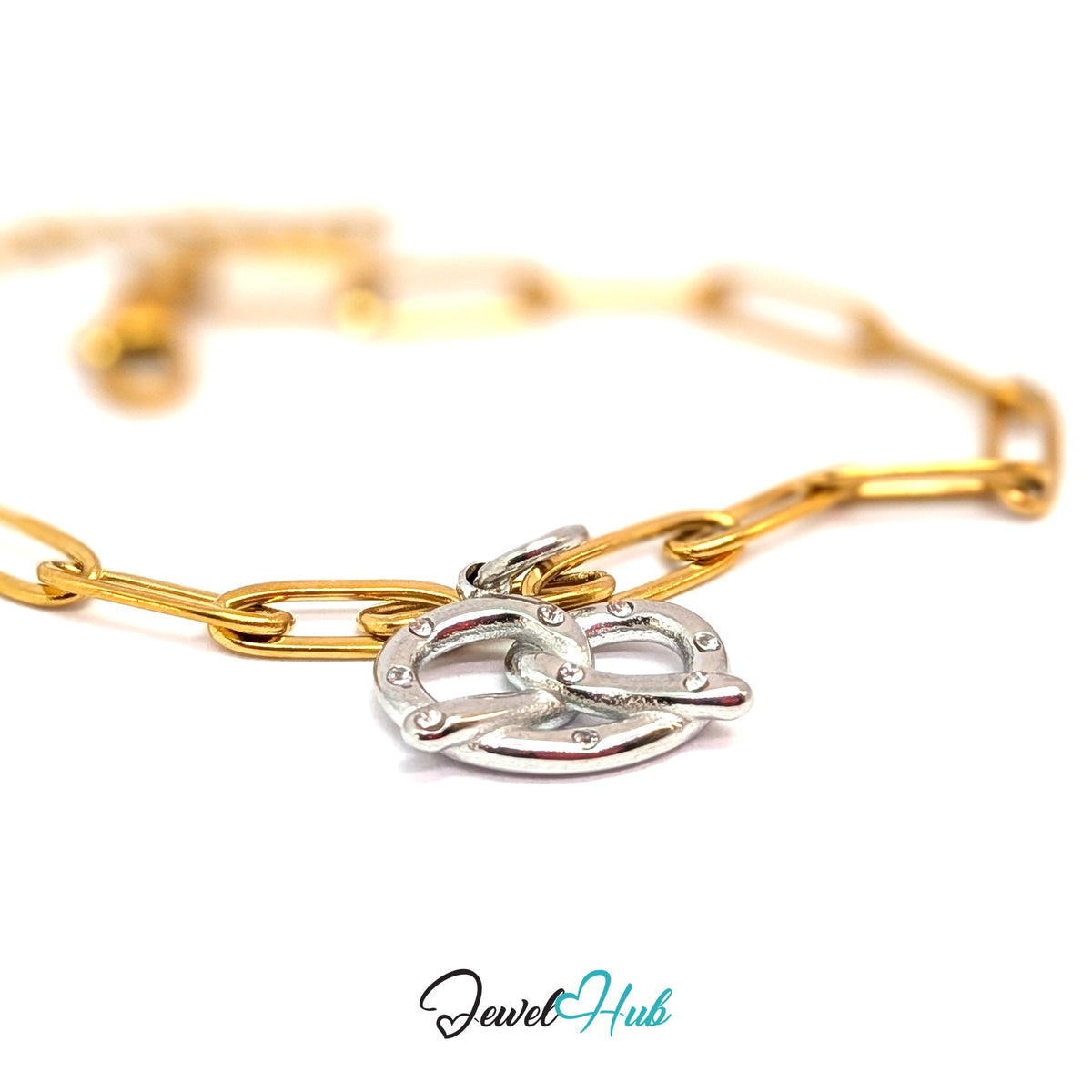 Silver-tone pretzel charm styled on a gold paperclip chain bracelet for a two-tone look - JewelHub