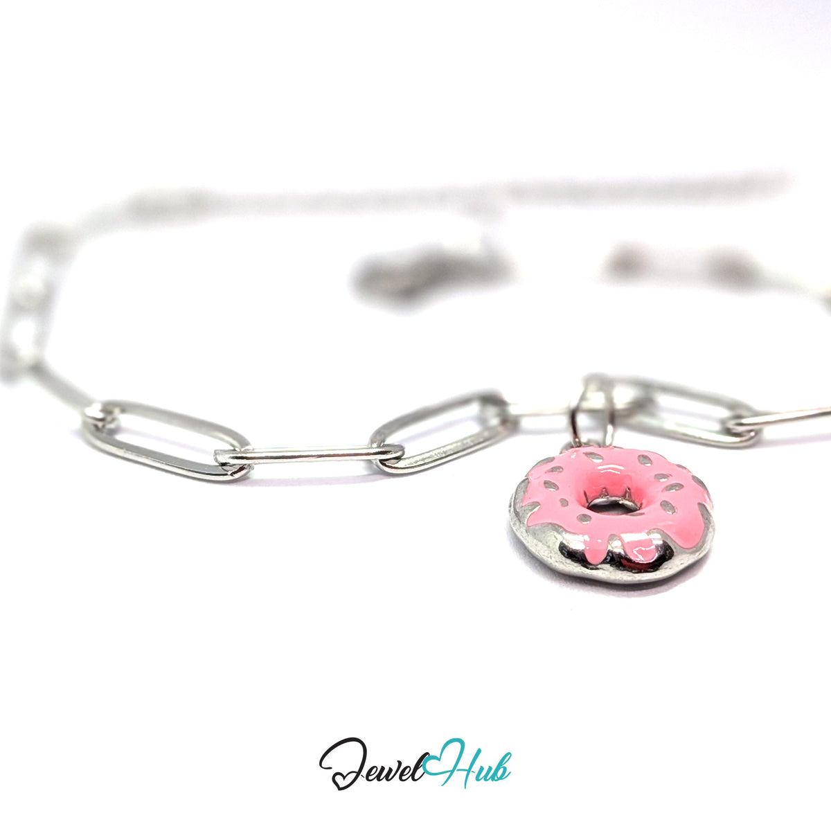 Silver-tone pink sprinkle donut charm styled on a silver paperclip chain bracelet - JewelHub