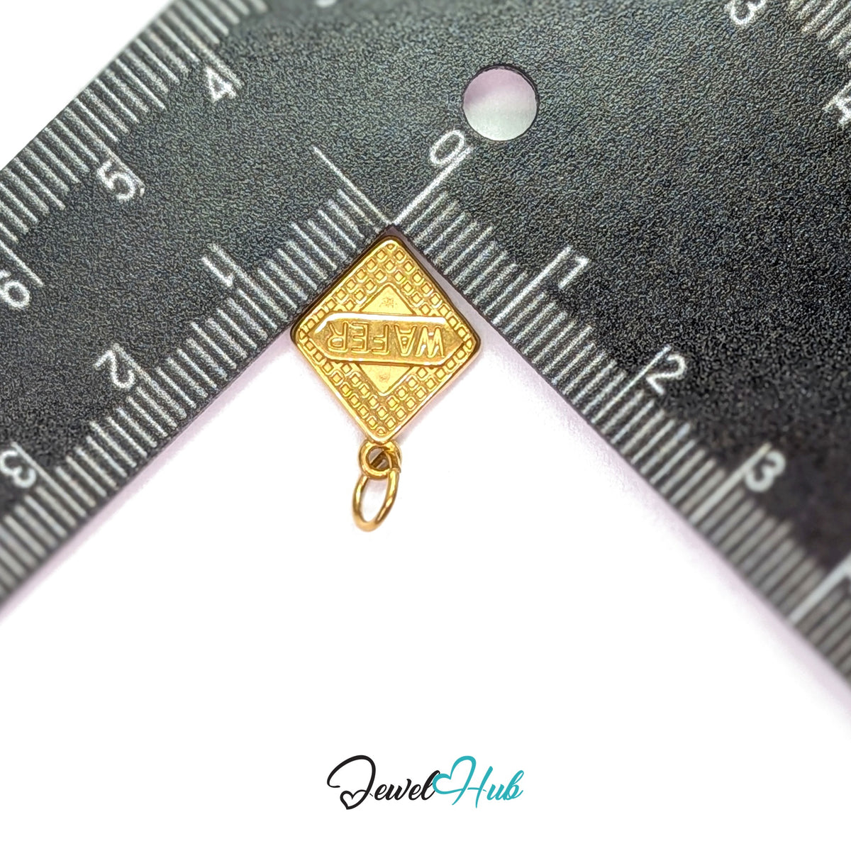 Wafer biscuit charm measured against a ruler at 14mm wide by 17.8mm tall - JewelHub