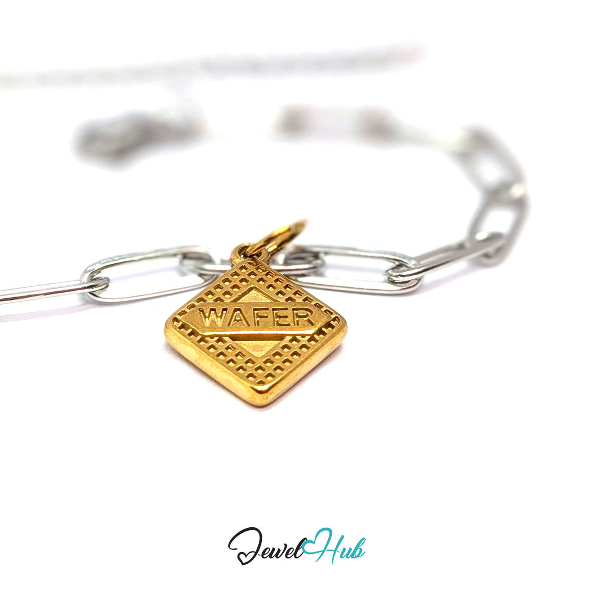 Gold-tone wafer biscuit charm styled on a silver paperclip chain bracelet for a two-tone look - JewelHub