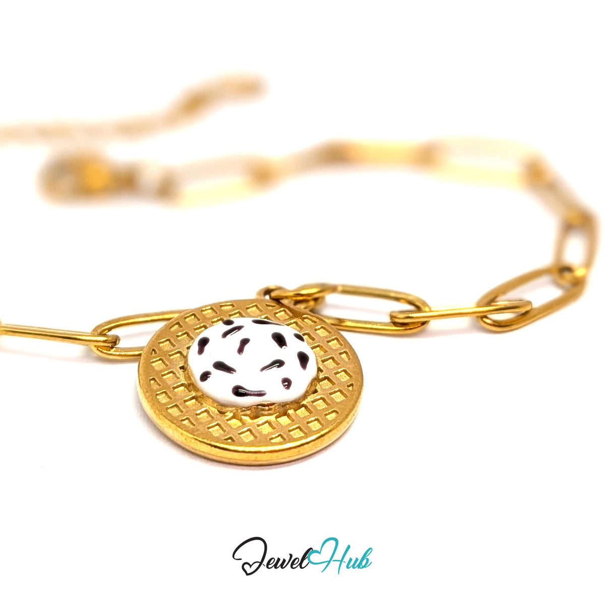 Gold-tone cookies and cream waffle charm styled on a gold paperclip chain bracelet - JewelHub
