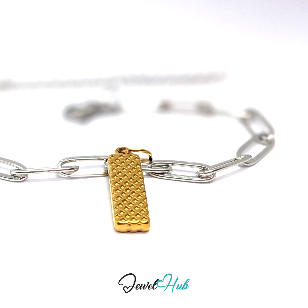 Gold-tone wafer stick charm styled on a silver paperclip chain bracelet for a two-tone look - JewelHub
