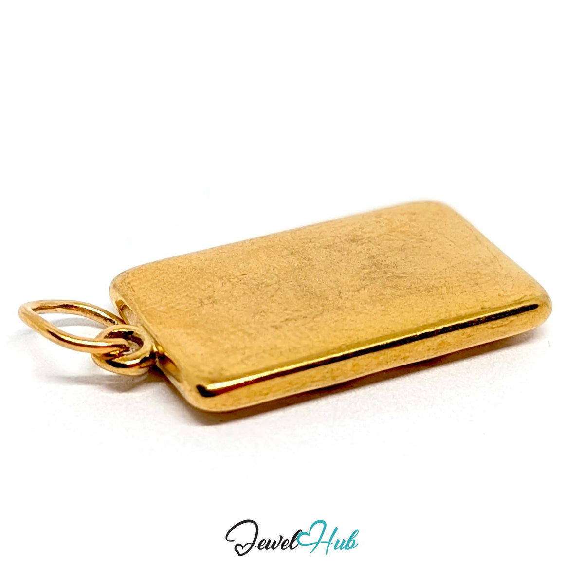 Close-up of the gold-tone dotted biscuit charm detail - JewelHub