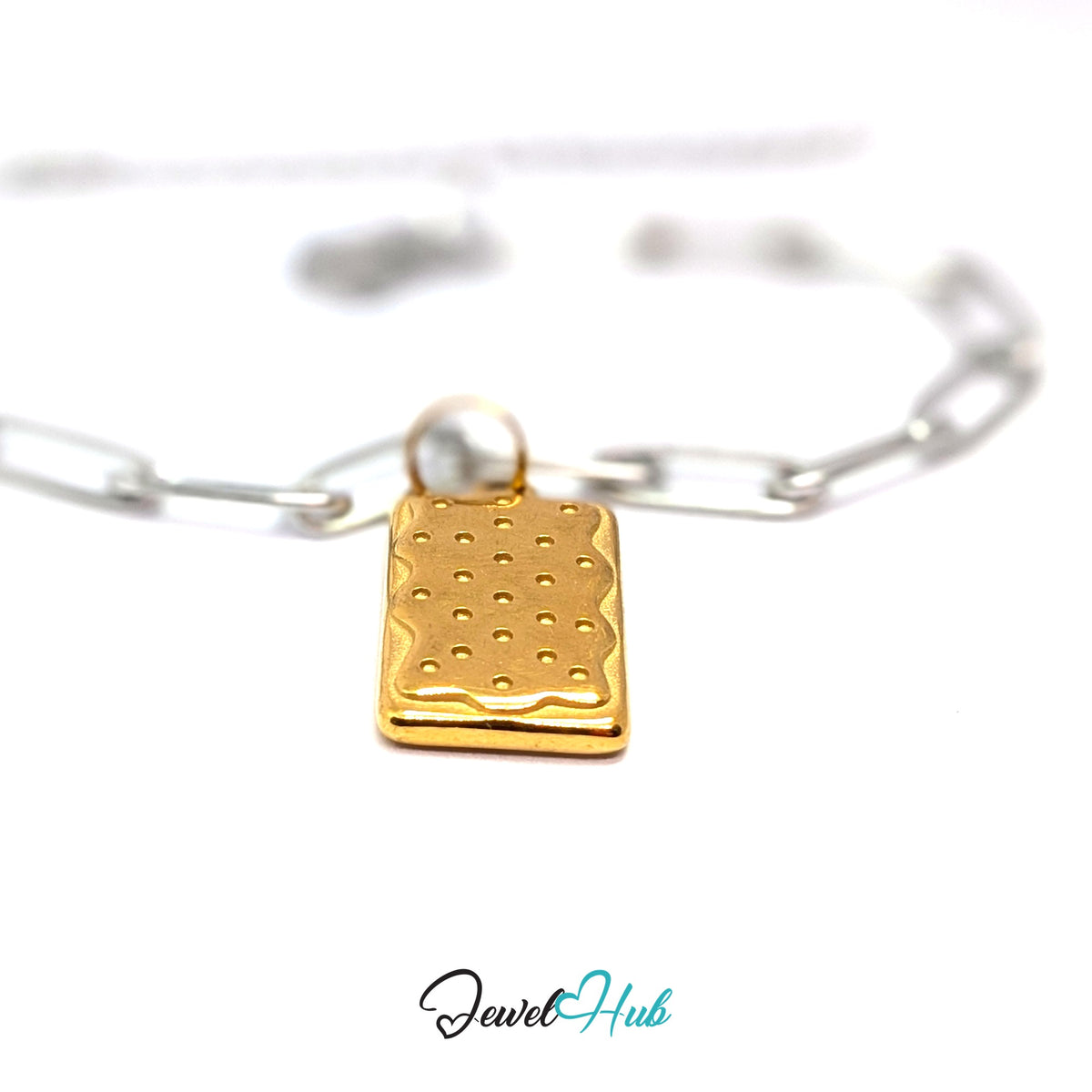 Gold-tone dotted biscuit charm styled on a silver paperclip chain bracelet for a two-tone look - JewelHub