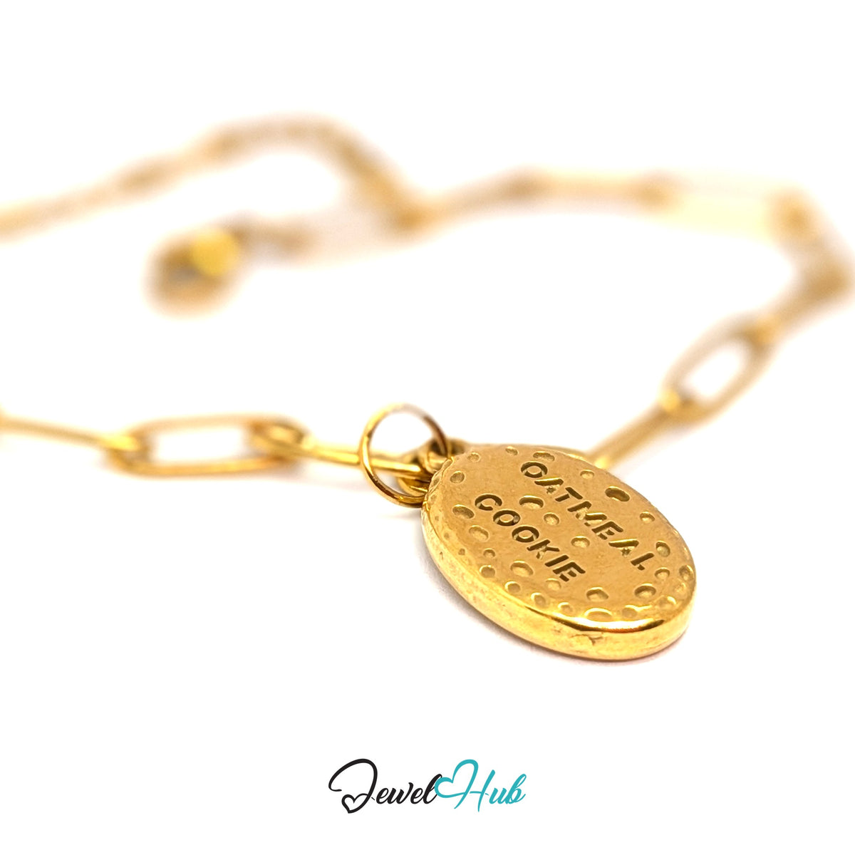 Gold-tone oatmeal cookie charm styled on a gold paperclip chain bracelet - JewelHub