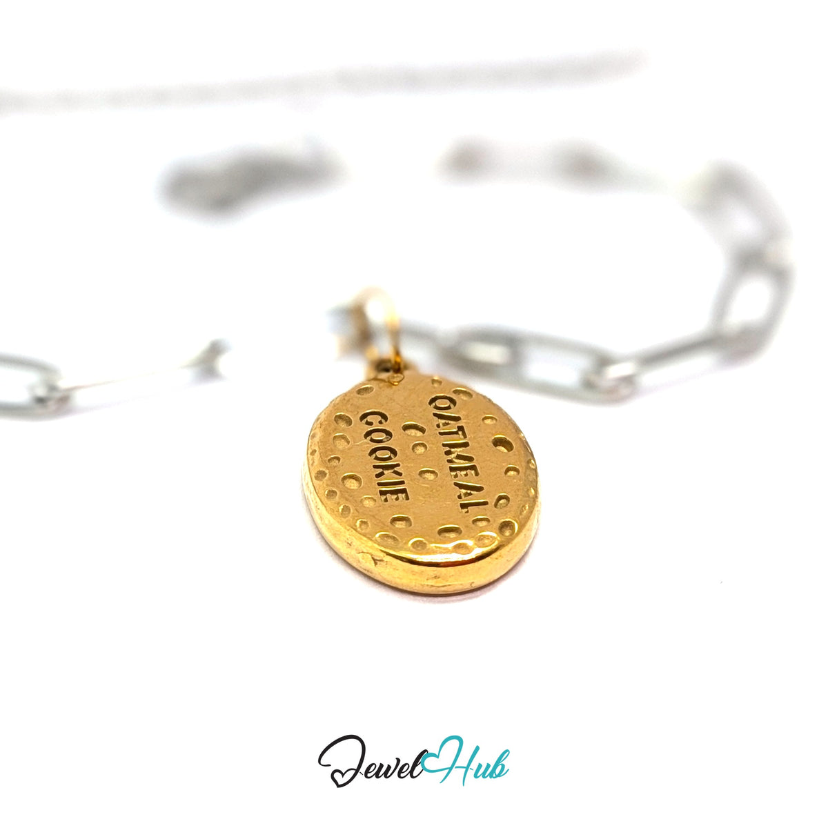 Gold-tone oatmeal cookie charm styled on a silver paperclip chain bracelet for a two-tone look - JewelHub