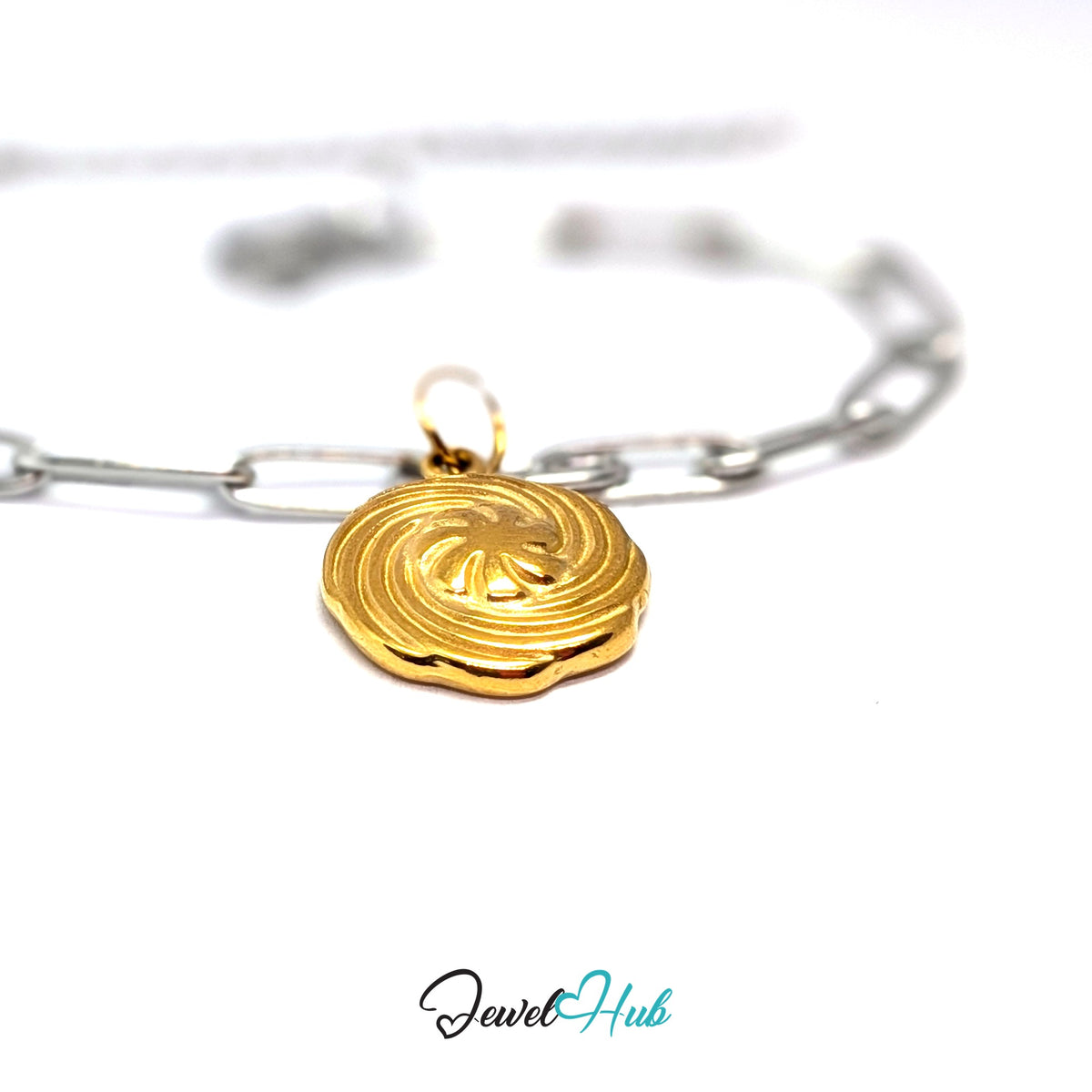 Gold-tone swirl butter cookie charm styled on a silver paperclip chain bracelet for a two-tone look - JewelHub