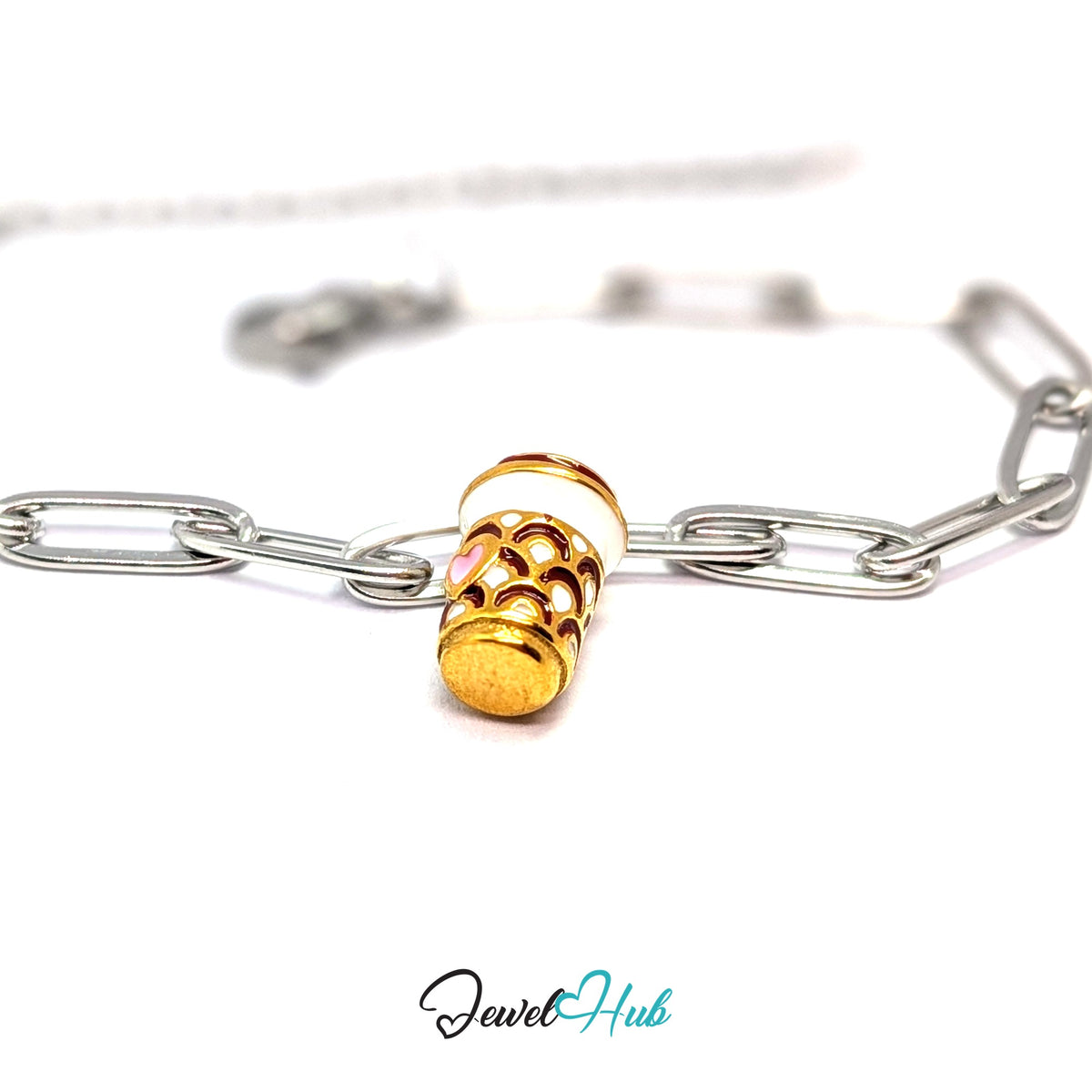 Gold-tone heart patterned coffee cup charm styled on a silver paperclip chain bracelet for a two-tone look - JewelHub
