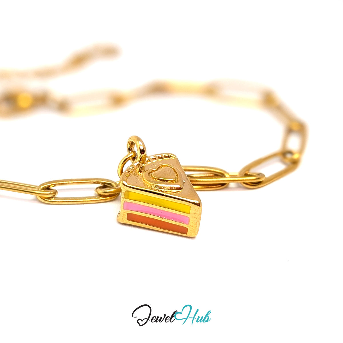 Gold-tone layered cake slice charm styled on a gold paperclip chain bracelet - JewelHub