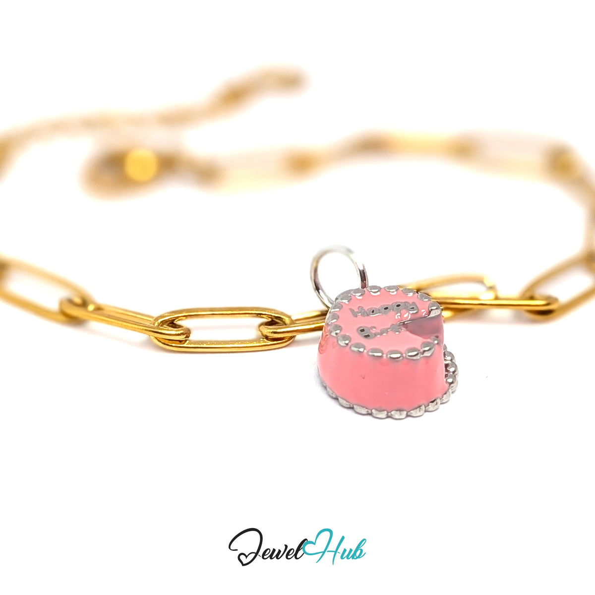 Silver-tone pink birthday cake charm styled on a gold paperclip chain bracelet for a two-tone look - JewelHub
