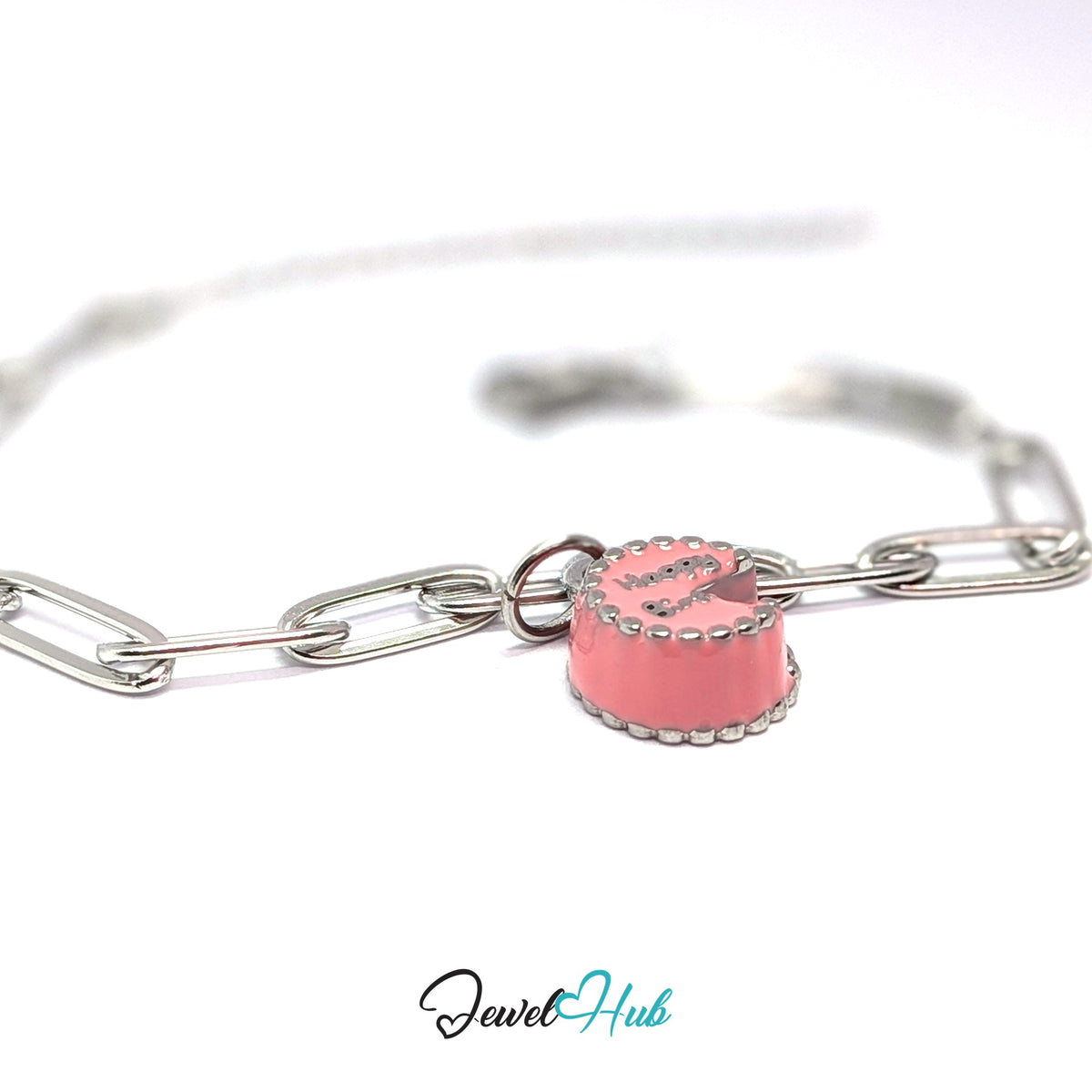 Silver-tone pink birthday cake charm styled on a silver paperclip chain bracelet - JewelHub
