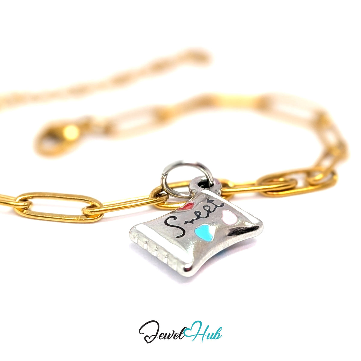Silver-tone sweet candy wrapper charm styled on a gold paperclip chain bracelet for a two-tone look - JewelHub