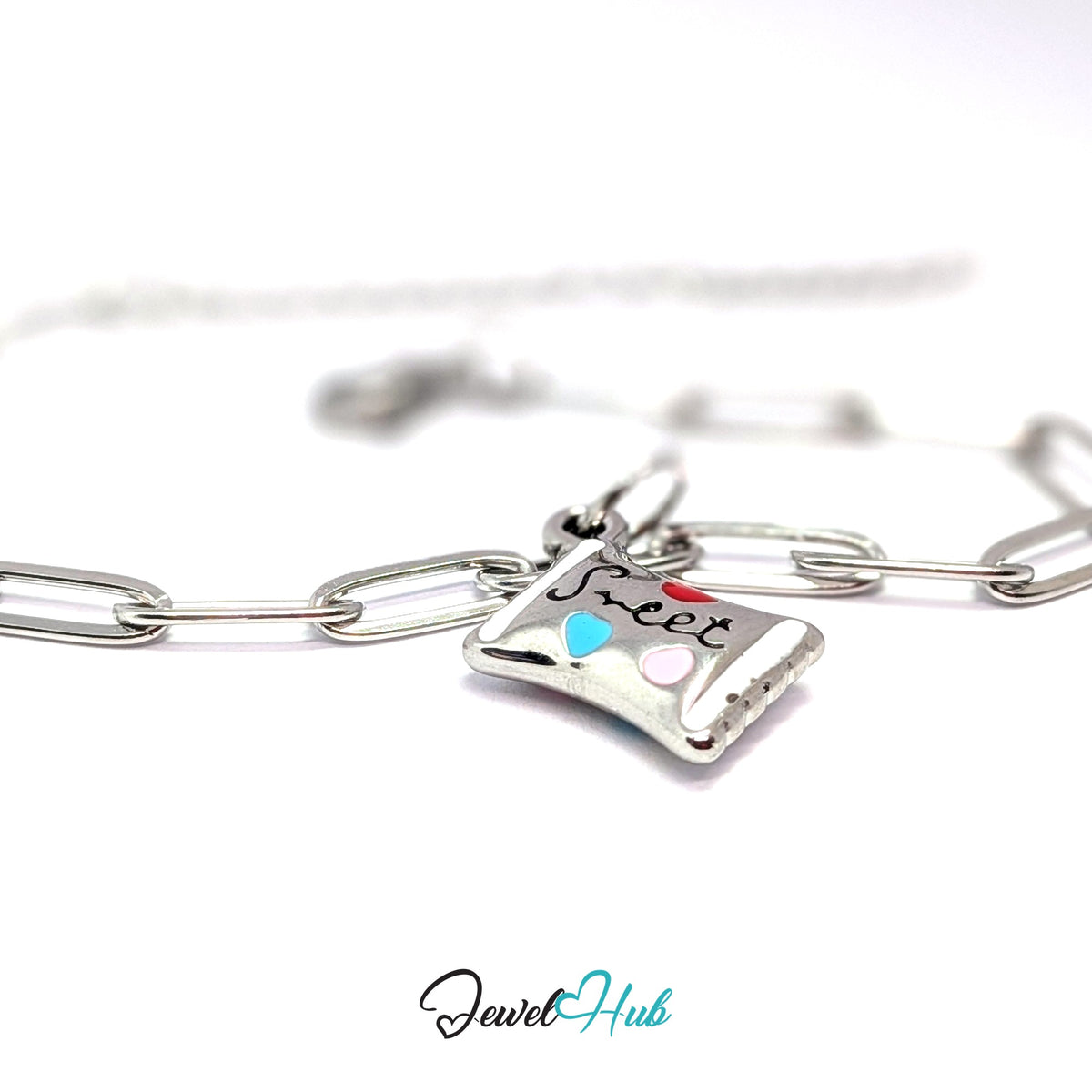 Silver-tone sweet candy wrapper charm styled on a silver paperclip chain bracelet - JewelHub