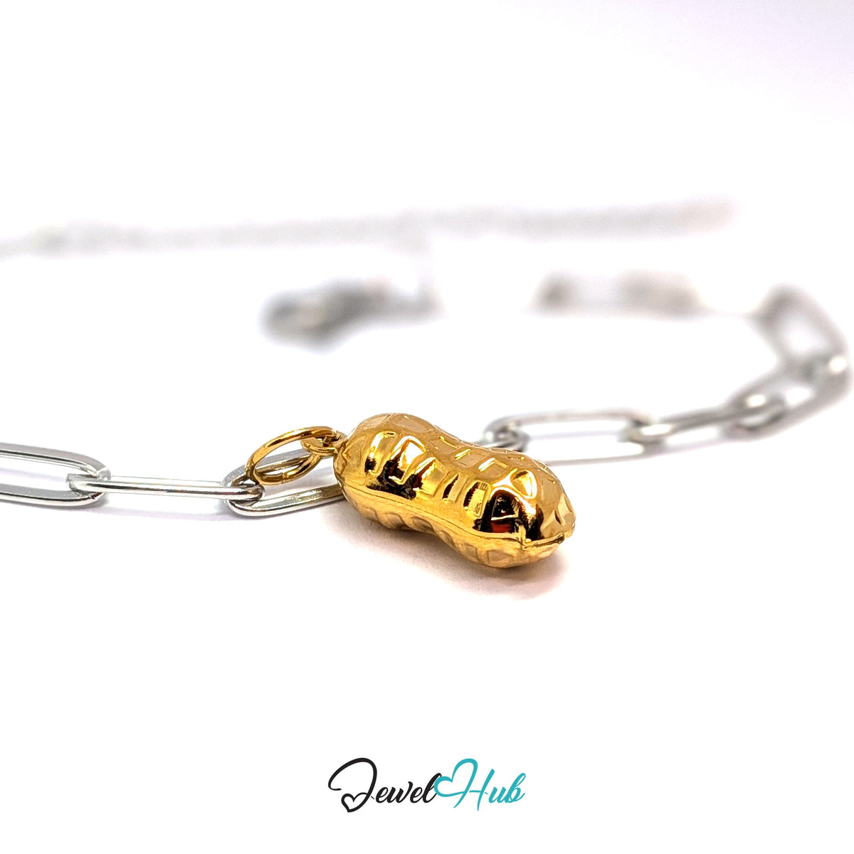 Gold-tone hammered peanut charm styled on a silver paperclip chain bracelet for a two-tone look - JewelHub
