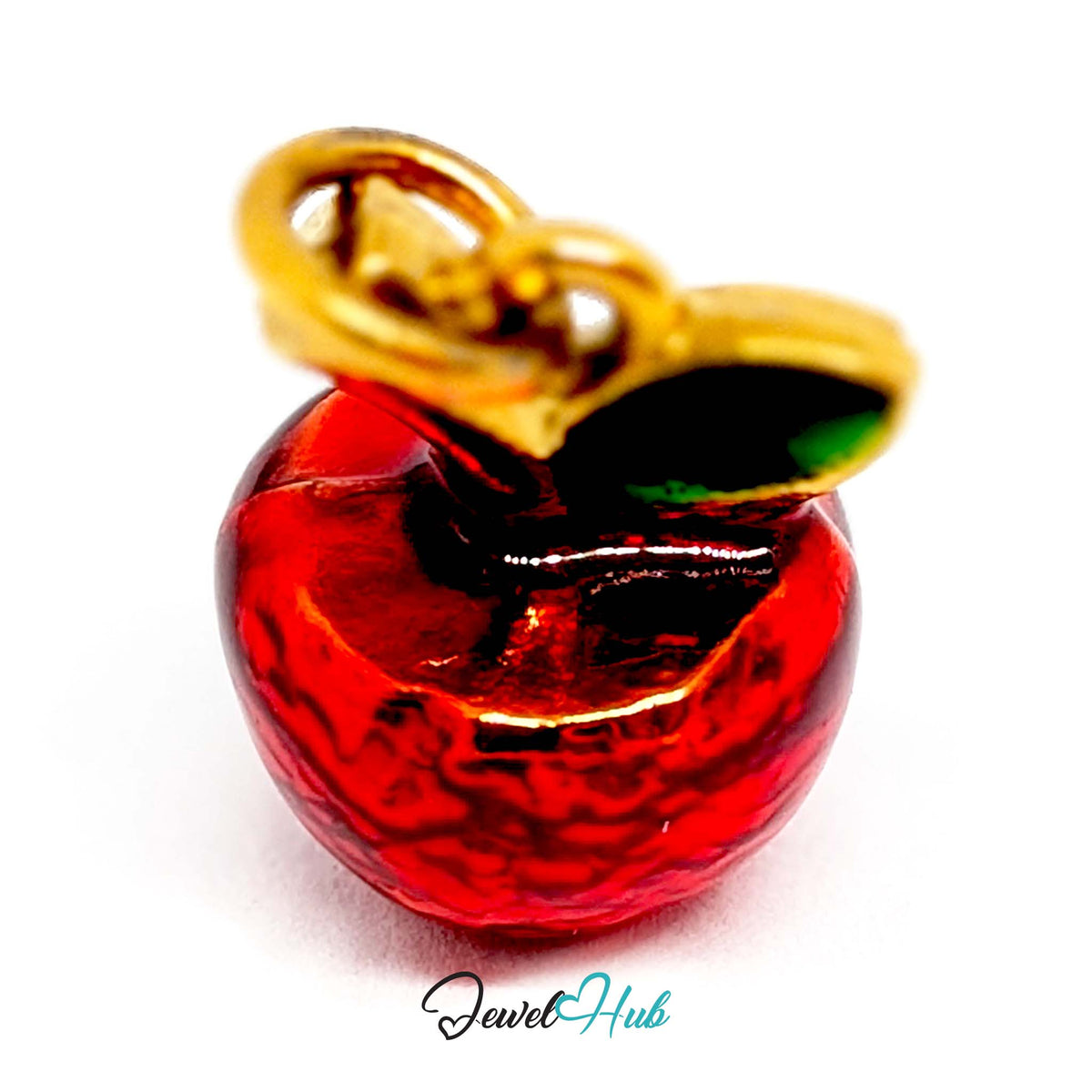 Angled view of the gold-tone red apple charm - JewelHub