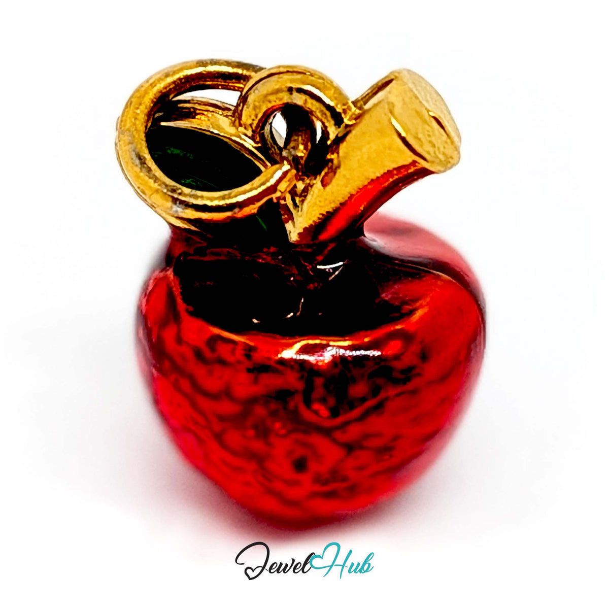 Close-up of the gold-tone red apple charm detail - JewelHub