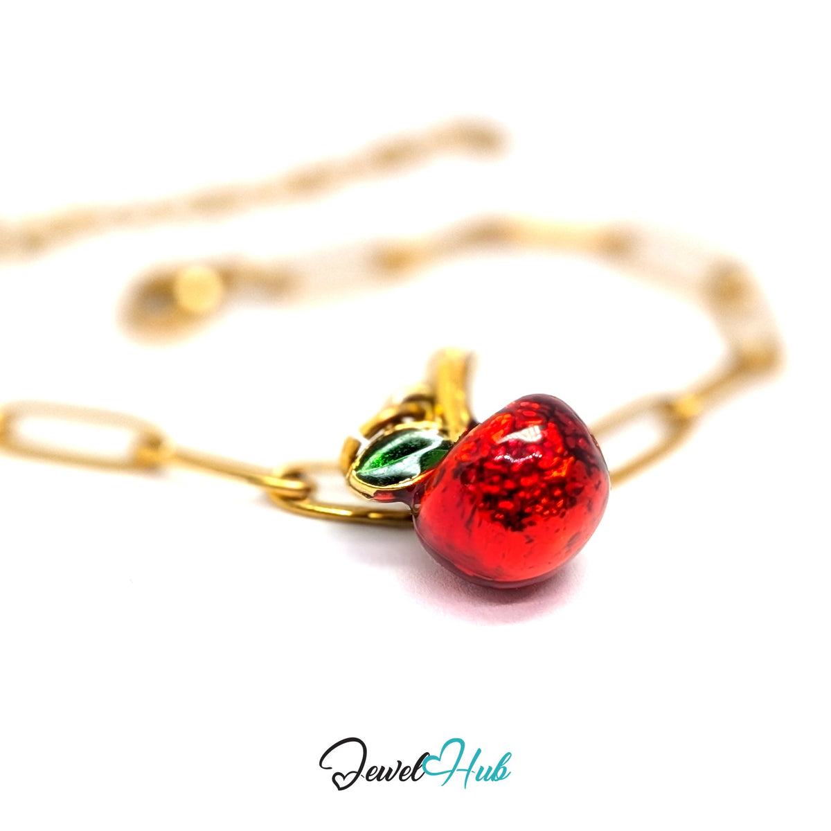 Gold-tone red apple charm styled on a gold paperclip chain bracelet - JewelHub