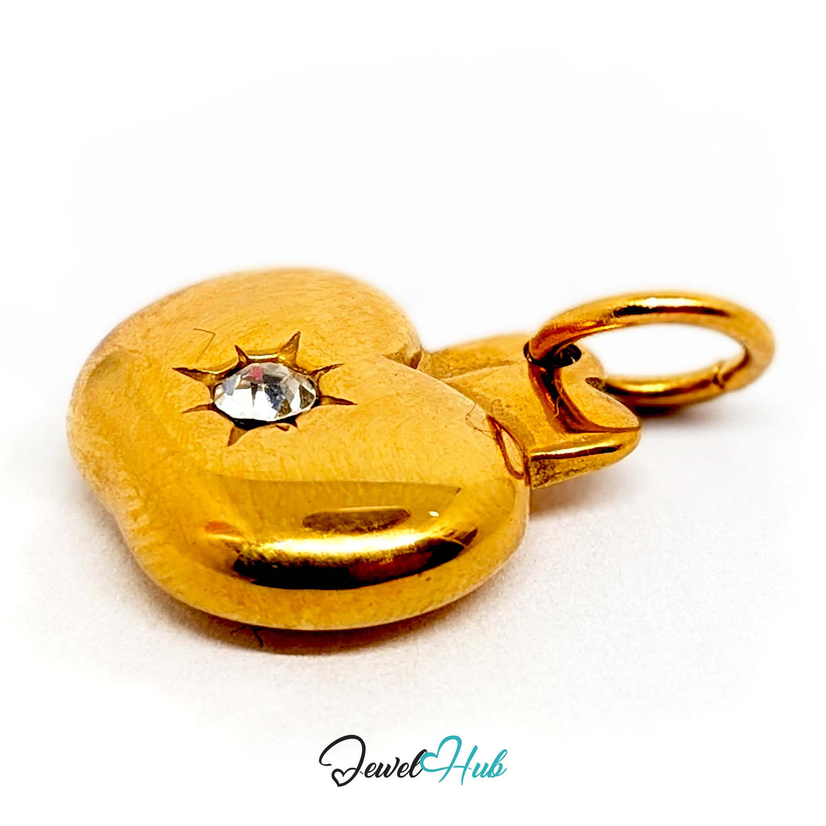 Angled view of the gold-tone crystal apple charm - JewelHub