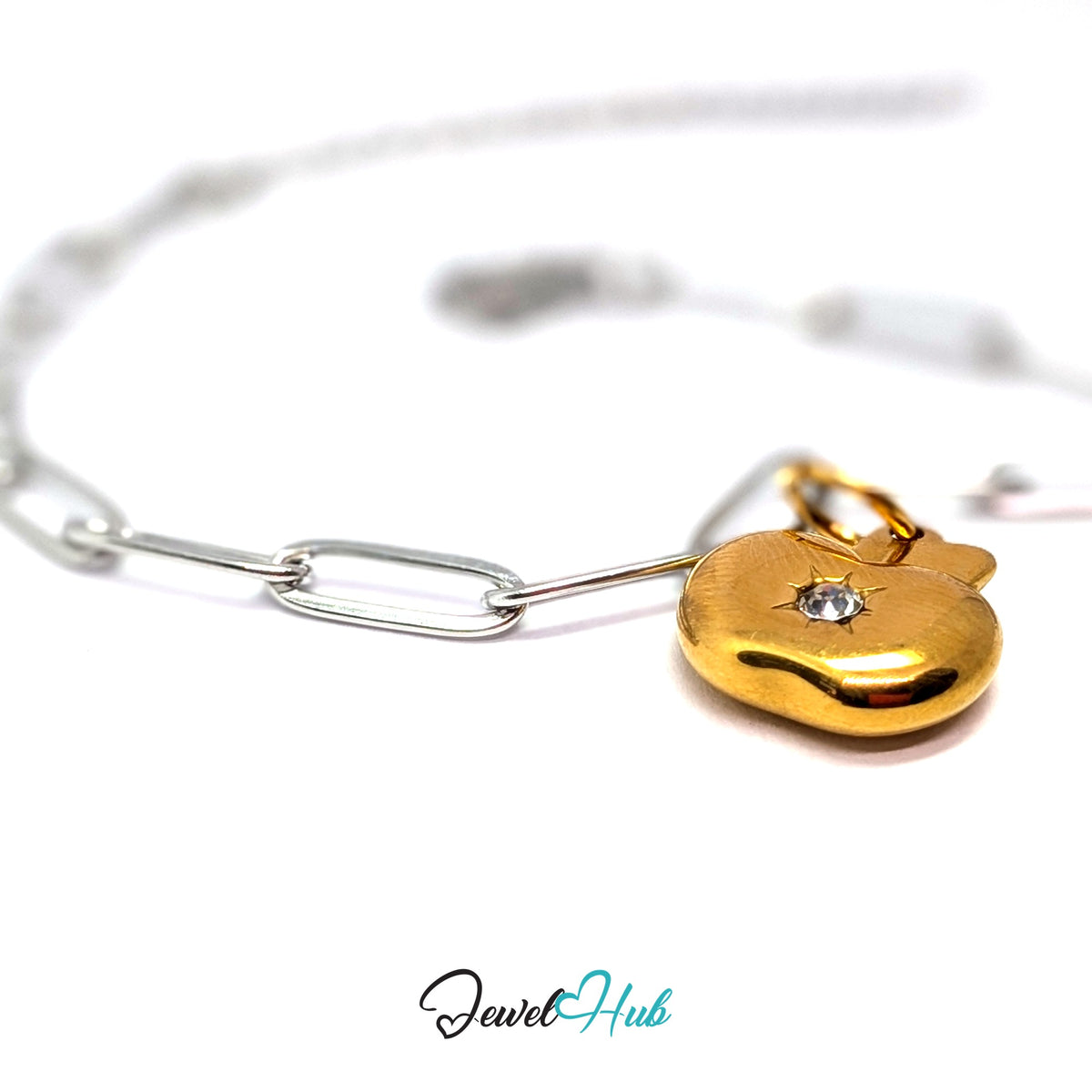 Gold-tone crystal apple charm styled on a silver paperclip chain bracelet for a two-tone look - JewelHub