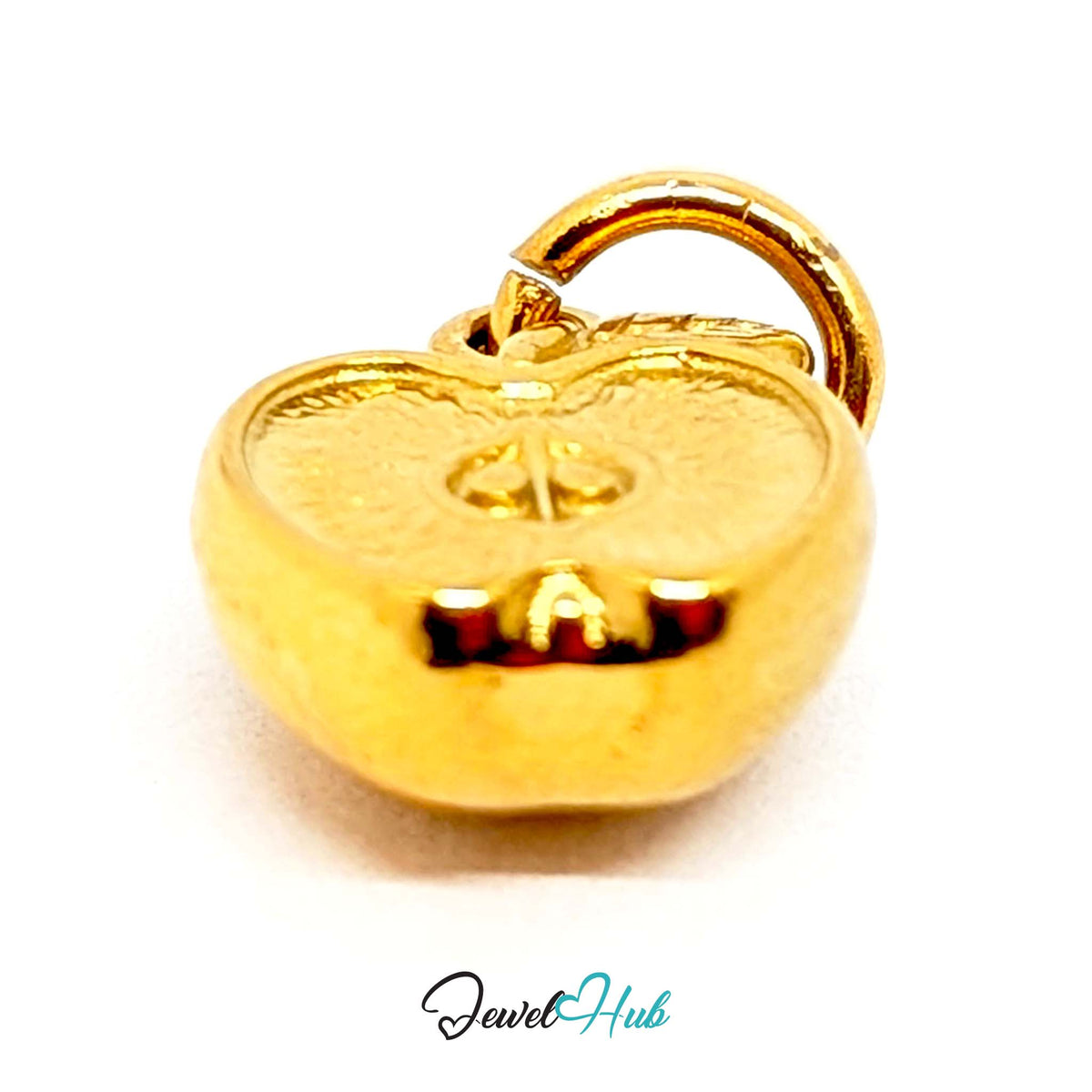 Angled view of the gold-tone apple half charm - JewelHub