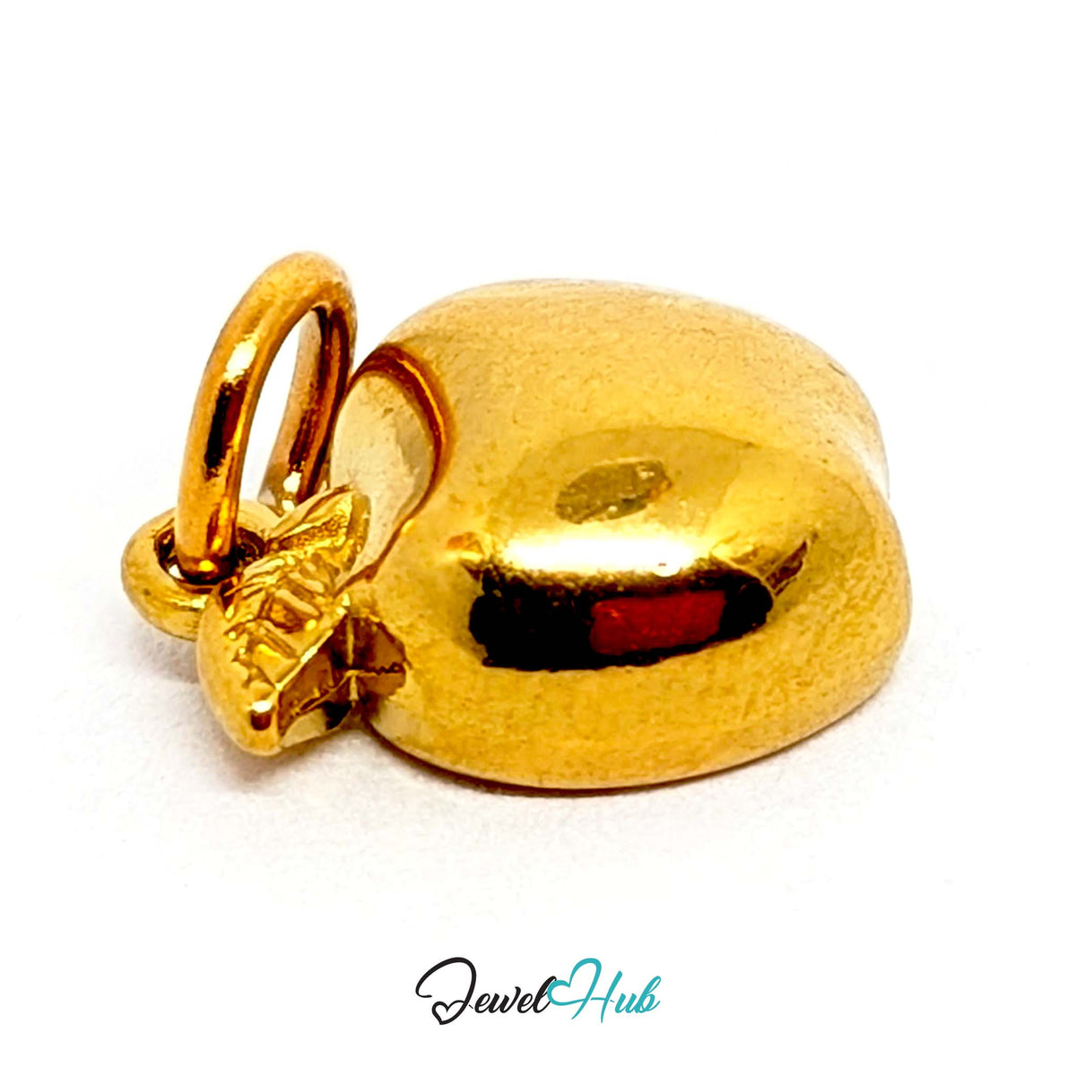Close-up of the gold-tone apple half charm detail - JewelHub
