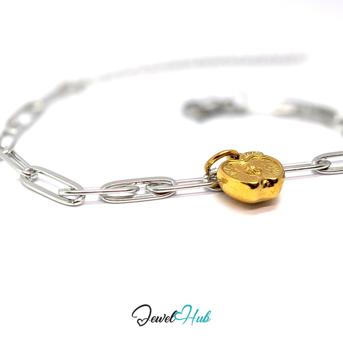 Gold-tone apple half charm styled on a silver paperclip chain bracelet for a two-tone look - JewelHub