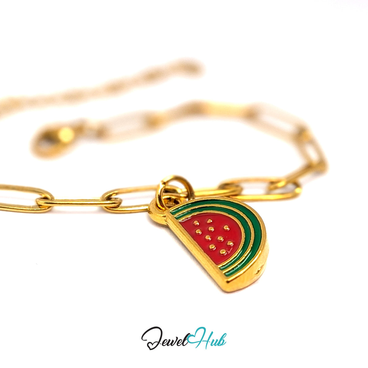 Gold-tone watermelon slice charm styled on a gold paperclip chain bracelet - JewelHub