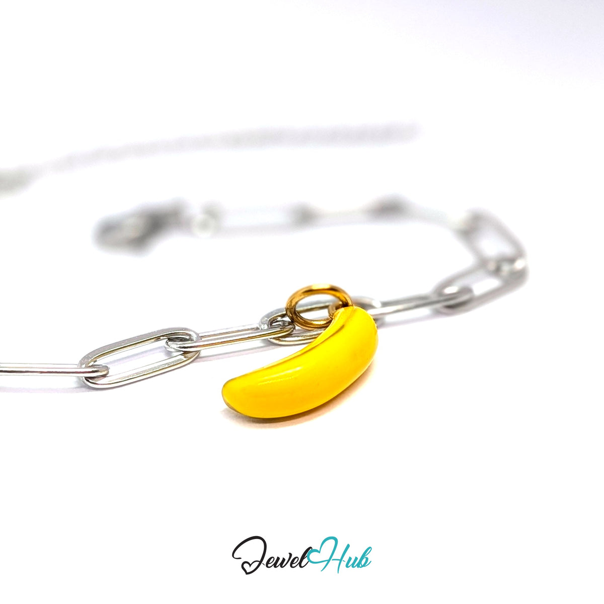 Gold-tone yellow enamel banana charm styled on a silver paperclip chain bracelet for a two-tone look - JewelHub