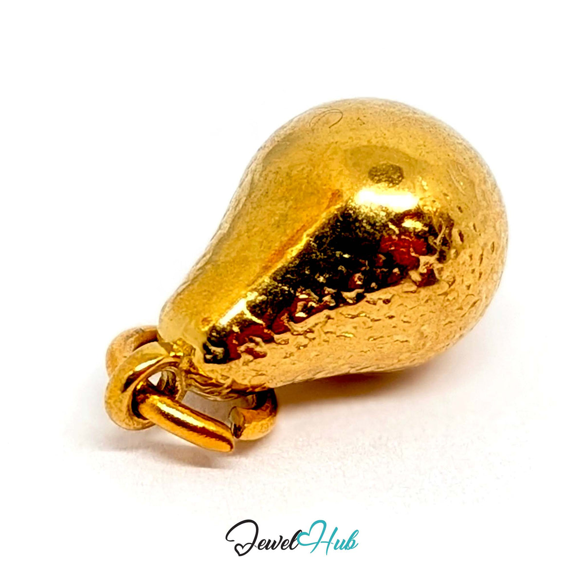 Angled view of the gold-tone hammered pear charm - JewelHub